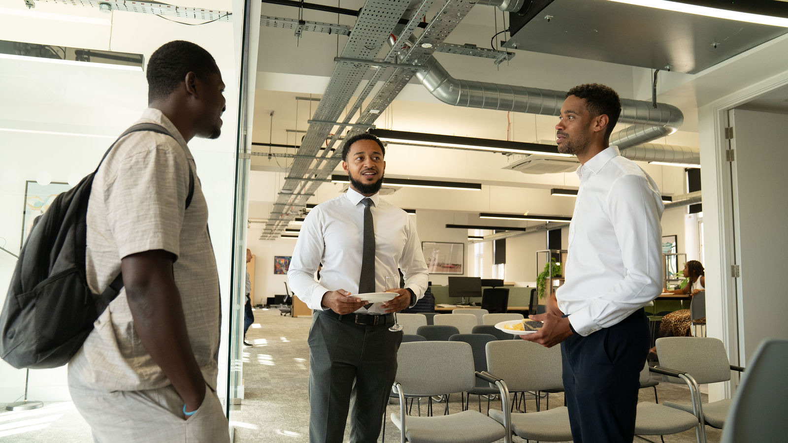 Three members of the Langford Pierce community talking at an investor event